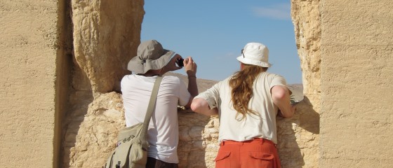 Picture 3: People looking out of window in ancient ruin